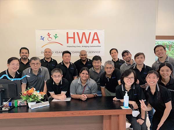 A photo of Euronet employees volunteering with the HWA