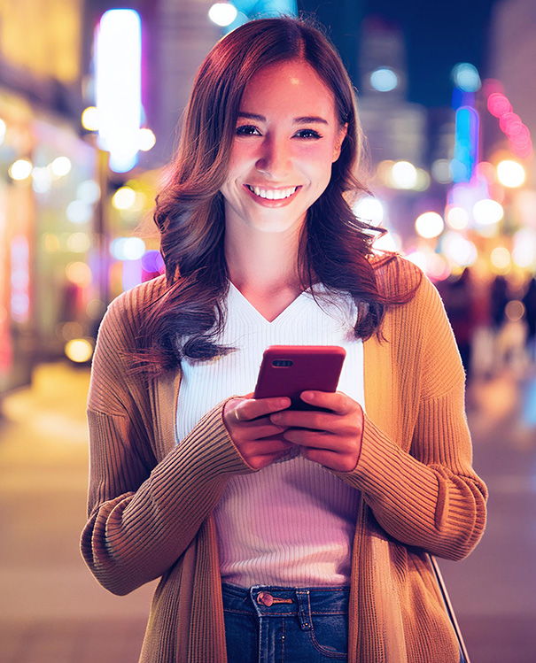 A photo of a woman with a smartphone